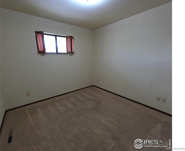 718 Linda St, Fort Morgan, CO 80701 - carpeted spare room featuring baseboards