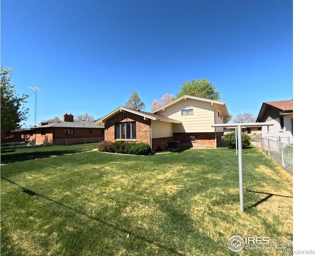 718 Linda St, Fort Morgan, CO 80701 - back of property with brick siding
