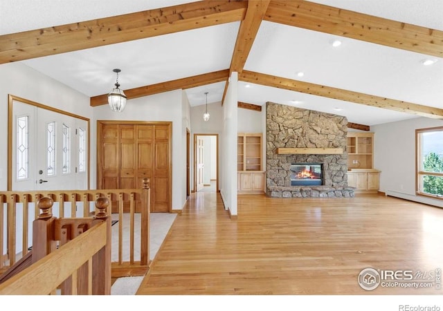 272 Solomon Dr, Estes Park, CO 80517 - foyer featuring light wood-type flooring, baseboard heating, recessed lighting, a stone fireplace, and baseboards