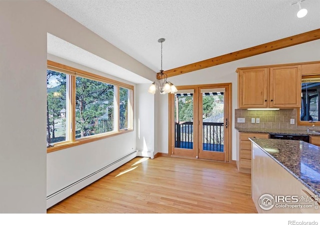 272 Solomon Dr, Estes Park, CO 80517 - kitchen with baseboard heating, a textured ceiling, light wood-style flooring, vaulted ceiling, and tasteful backsplash