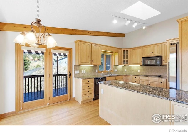 272 Solomon Dr, Estes Park, CO 80517 - kitchen with black appliances, light brown cabinets, a sink, decorative backsplash, and lofted ceiling