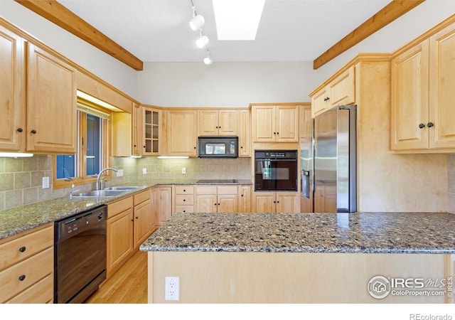 272 Solomon Dr, Estes Park, CO 80517 - kitchen with light brown cabinets, black appliances, a sink, dark stone countertops, and backsplash