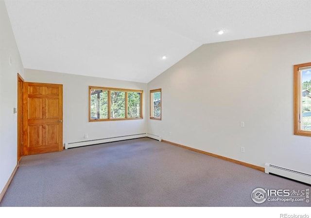 272 Solomon Dr, Estes Park, CO 80517 - carpeted spare room featuring a baseboard heating unit, lofted ceiling, a baseboard radiator, healthy amount of natural light, and baseboards