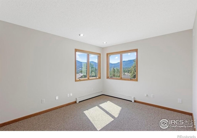 272 Solomon Dr, Estes Park, CO 80517 - spare room with carpet, baseboard heating, baseboards, recessed lighting, and a textured ceiling