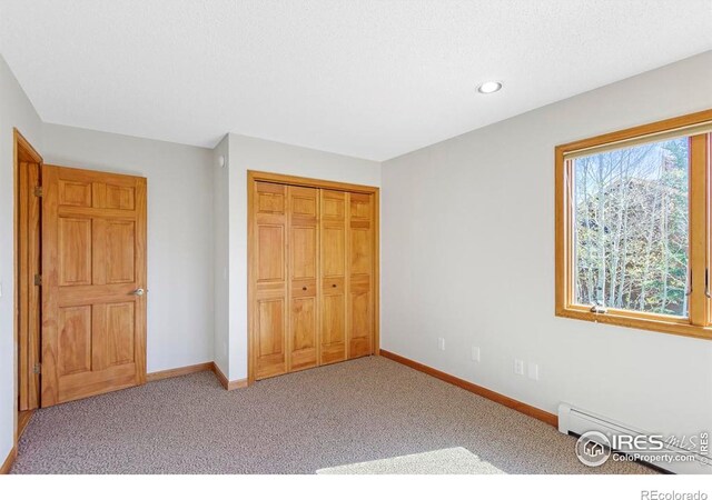 272 Solomon Dr, Estes Park, CO 80517 - unfurnished bedroom with baseboards, carpet, recessed lighting, and a closet