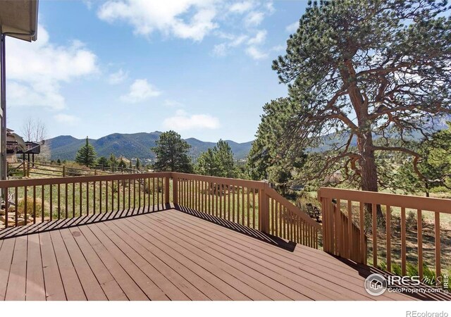 272 Solomon Dr, Estes Park, CO 80517 - wooden terrace with a mountain view and fence