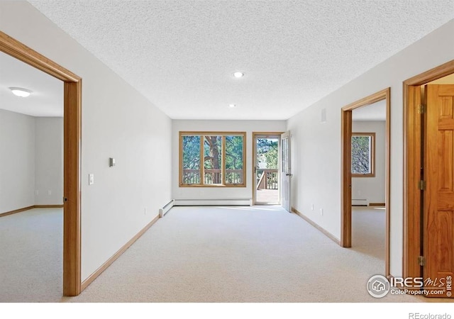 272 Solomon Dr, Estes Park, CO 80517 - carpeted empty room with baseboard heating, baseboards, a textured ceiling, and recessed lighting