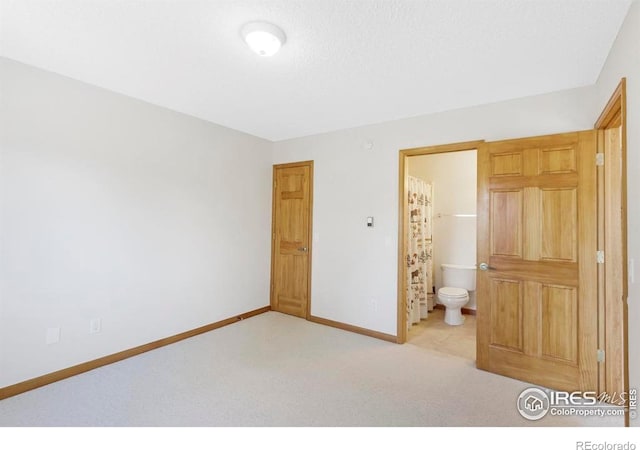 272 Solomon Dr, Estes Park, CO 80517 - unfurnished bedroom with carpet, baseboards, and ensuite bathroom