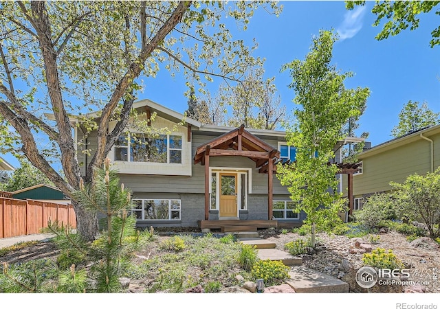 2550 Woodstock Pl, Boulder, CO 80305 - split foyer home with fence and brick siding