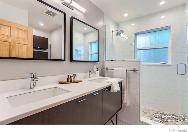 2550 Woodstock Pl, Boulder, CO 80305 - full bathroom with a walk in shower, double vanity, and recessed lighting