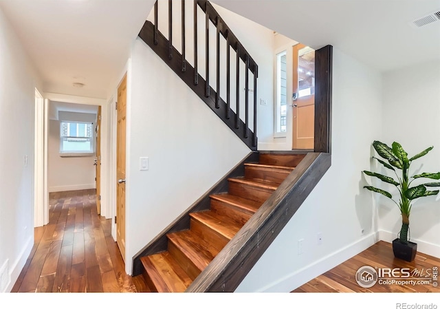 2550 Woodstock Pl, Boulder, CO 80305 - staircase featuring hardwood / wood-style floors and baseboards