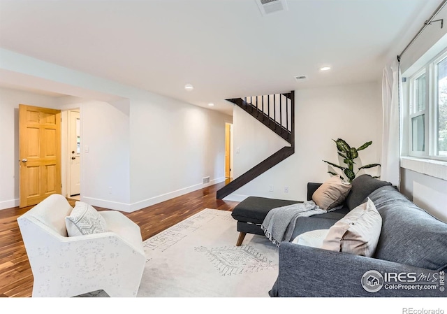 2550 Woodstock Pl, Boulder, CO 80305 - living area featuring wood finished floors, stairs, baseboards, and recessed lighting