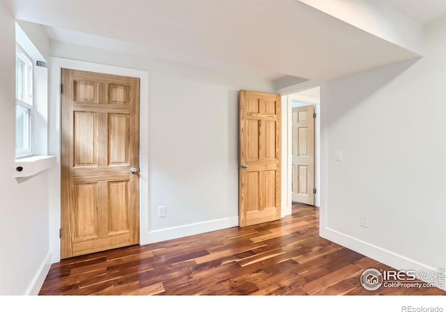 2550 Woodstock Pl, Boulder, CO 80305 - empty room with dark wood-style flooring and baseboards