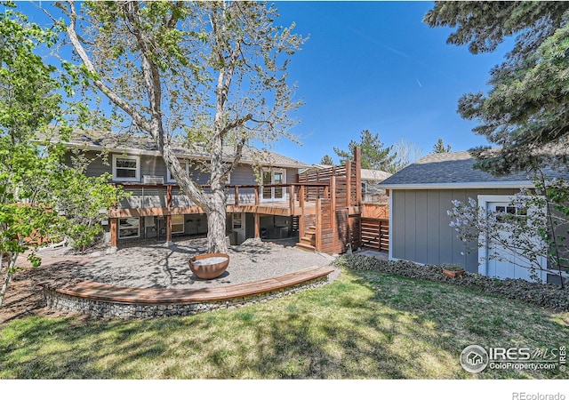 2550 Woodstock Pl, Boulder, CO 80305 - back of property with a deck, stairs, and a yard