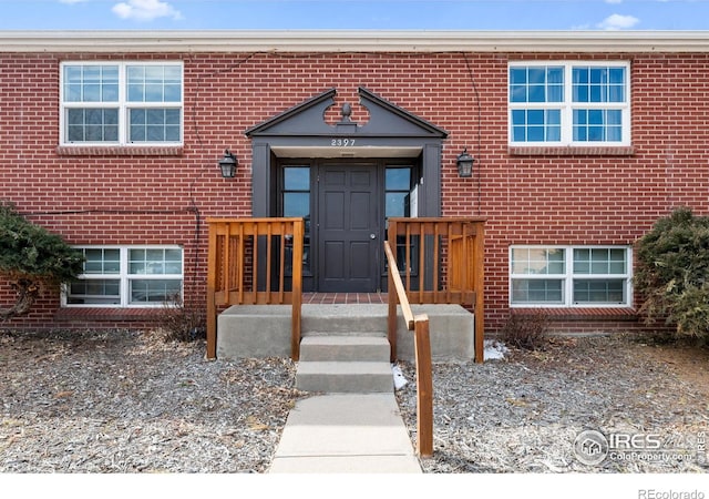 view of front of house with brick siding