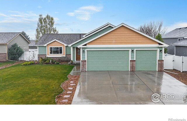 view of front facade featuring an attached garage, driveway, brick siding, and a gate