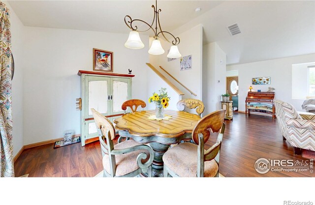 dining room featuring wood finished floors, french doors, vaulted ceiling, and baseboards