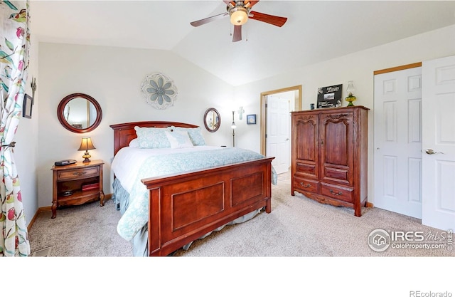 bedroom with light carpet, vaulted ceiling, ceiling fan, and baseboards