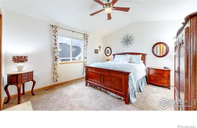 bedroom featuring vaulted ceiling, light colored carpet, baseboards, and a ceiling fan