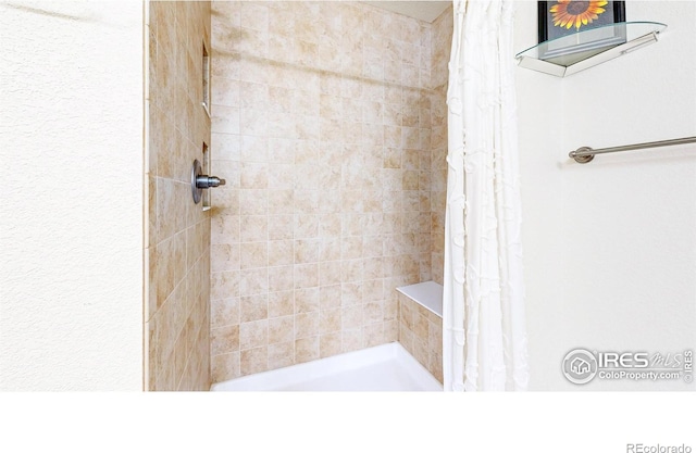 full bathroom with a tile shower