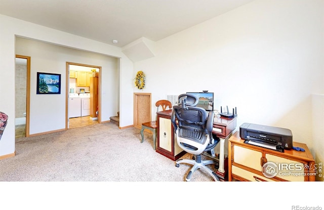 carpeted office featuring independent washer and dryer and baseboards