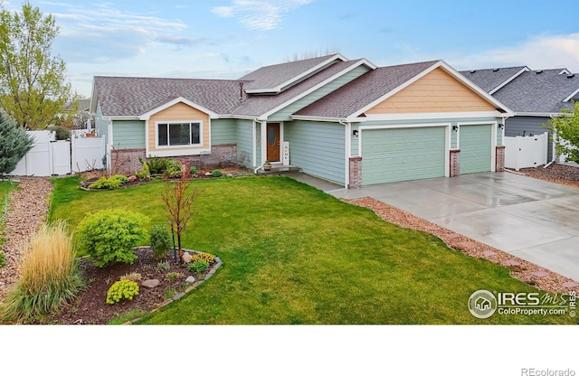 view of front of property featuring an attached garage, brick siding, driveway, and a gate