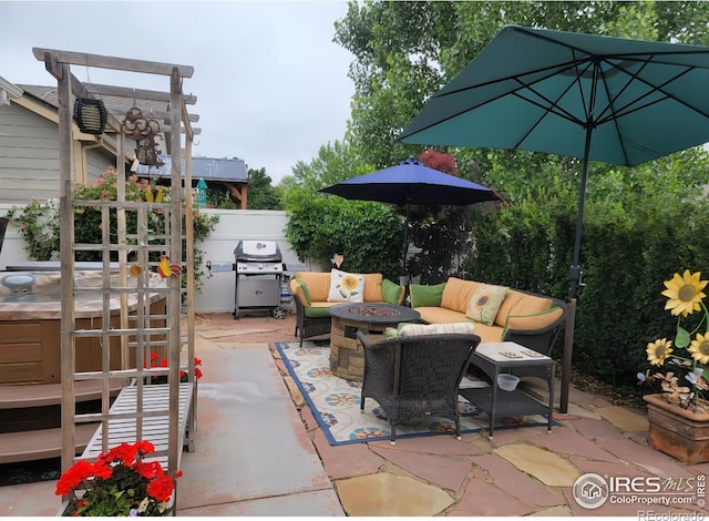 3705 Mount Spalding St, Wellington, CO 80549 - view of patio / terrace featuring an outdoor living space with a fire pit, grilling area, and a hot tub