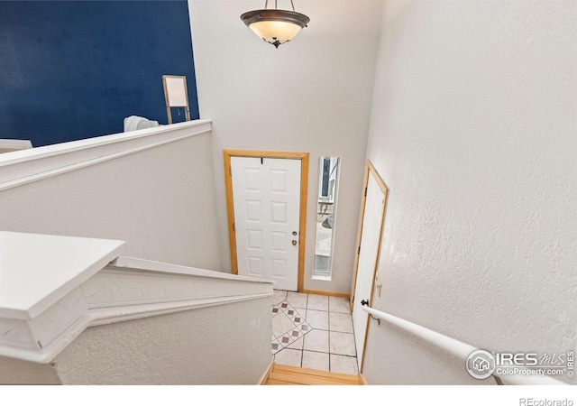 foyer with light tile patterned floors