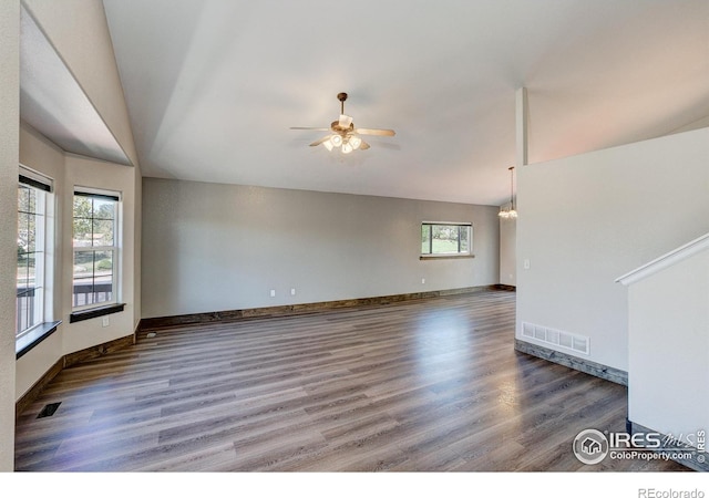 3530 Homestead Dr, Mead, CO 80542 - unfurnished living room featuring healthy amount of natural light, wood finished floors, ceiling fan, baseboards, and lofted ceiling