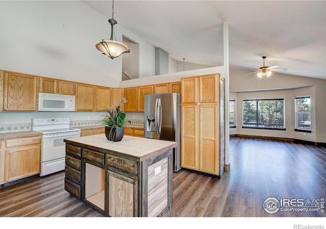 3530 Homestead Dr, Mead, CO 80542 - kitchen with white appliances, tile countertops, a center island, wood finished floors, and high vaulted ceiling