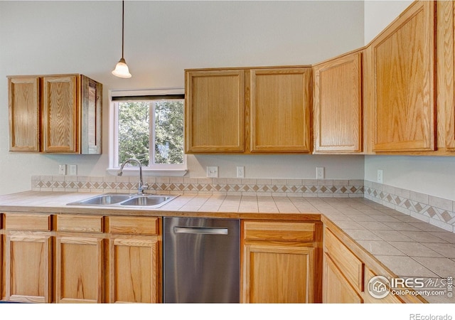 3530 Homestead Dr, Mead, CO 80542 - kitchen featuring stainless steel dishwasher, a sink, tile counters, and decorative light fixtures