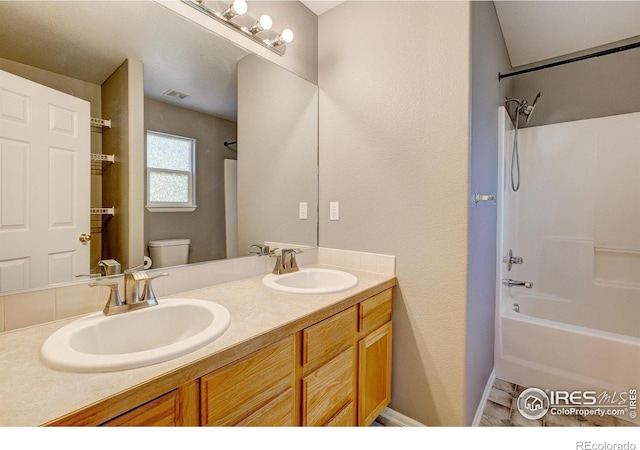 3530 Homestead Dr, Mead, CO 80542 - full bathroom with toilet, double vanity, and shower / tub combination