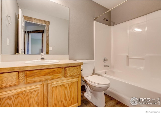 3530 Homestead Dr, Mead, CO 80542 - full bathroom with wood finished floors, vanity, toilet, and bathing tub / shower combination
