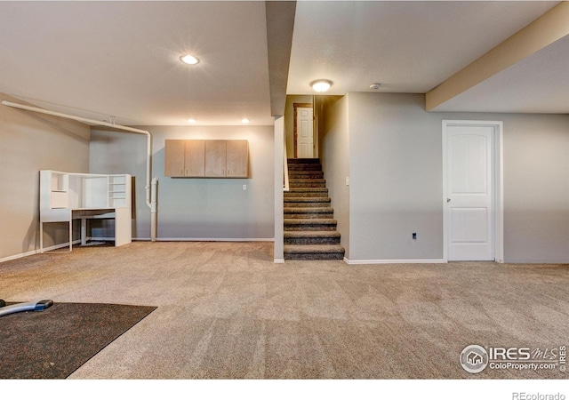 3530 Homestead Dr, Mead, CO 80542 - finished basement with carpet flooring, stairway, baseboards, and recessed lighting