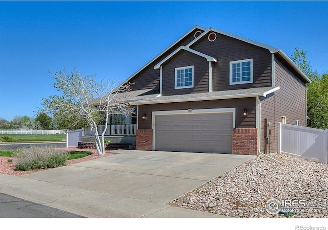 3530 Homestead Dr, Mead, CO 80542 - view of front of house featuring driveway, fence, and brick siding