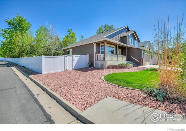 3530 Homestead Dr, Mead, CO 80542 - view of front of property with a gate, a porch, fence, and a garage
