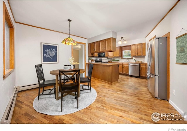 dining area featuring a baseboard radiator, light wood-type flooring, and baseboards