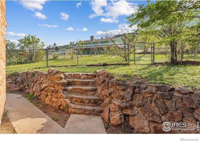view of yard with a gate