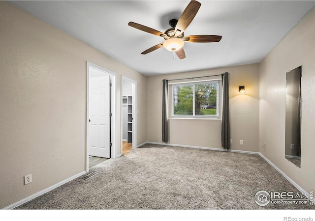 2002 E 102nd Cir, Thornton, CO 80229 - unfurnished bedroom featuring carpet floors, a spacious closet, baseboards, and ceiling fan