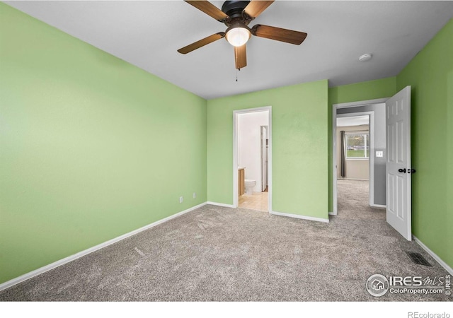 2002 E 102nd Cir, Thornton, CO 80229 - unfurnished bedroom with baseboards, carpet floors, ensuite bathroom, and ceiling fan
