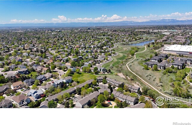 2002 E 102nd Cir, Thornton, CO 80229 - aerial perspective of suburban area with a water and mountain view