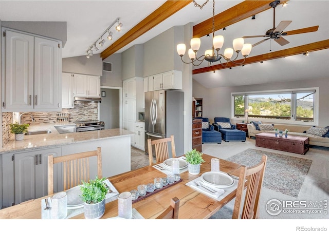 6300 Feldspar Ct, Bellvue, CO 80512 - dining space with ceiling fan, beam ceiling, a chandelier, and high vaulted ceiling