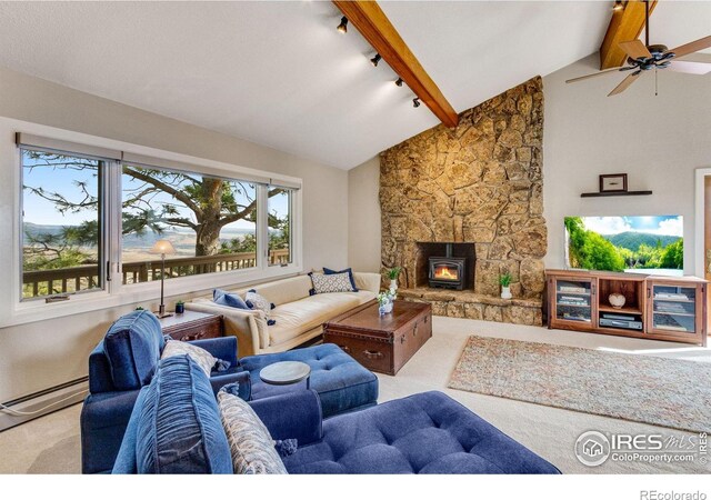 6300 Feldspar Ct, Bellvue, CO 80512 - living room featuring carpet flooring, a baseboard heating unit, ceiling fan, a fireplace, and track lighting