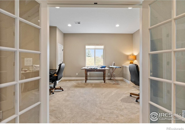 carpeted office space featuring baseboards, recessed lighting, and french doors