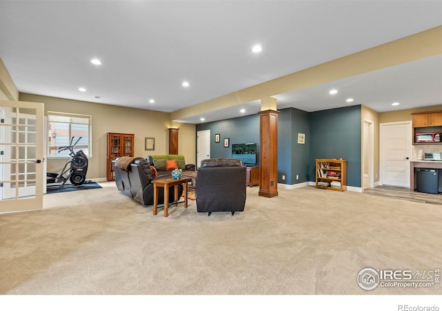 living area featuring light carpet, recessed lighting, baseboards, and french doors