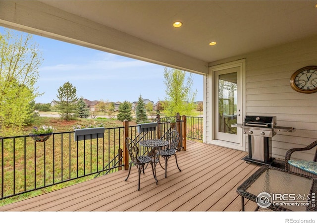 wooden deck featuring grilling area