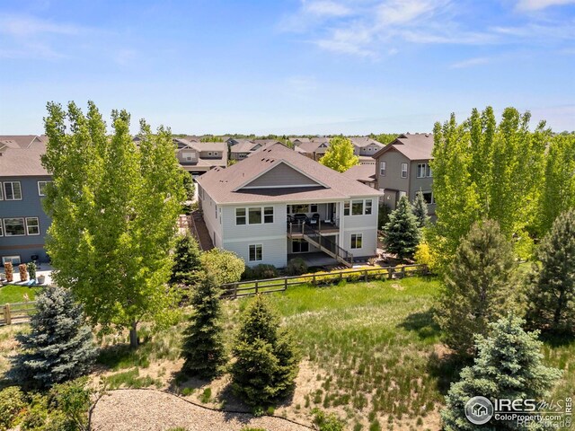 2551 Cub Lake Ct, Loveland, CO 80538 - back of property featuring a residential view and a shingled roof