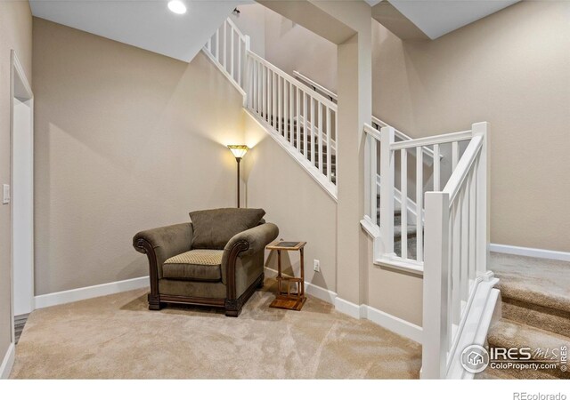 2551 Cub Lake Ct, Loveland, CO 80538 - living area featuring carpet floors, stairway, and baseboards