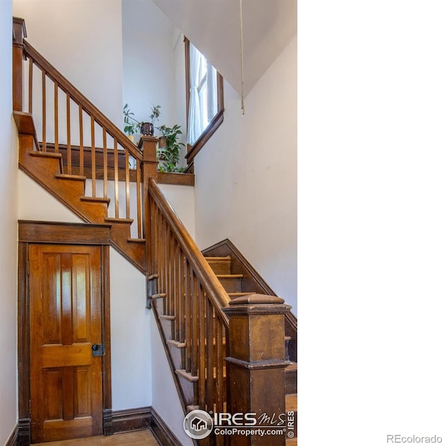 2645 5th St, Boulder, CO 80304 - stairway featuring a towering ceiling and baseboards