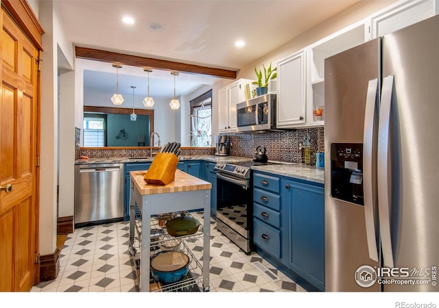 2645 5th St, Boulder, CO 80304 - kitchen with stainless steel appliances, blue cabinets, healthy amount of natural light, white cabinets, and beamed ceiling